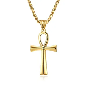 Macro view of polished gold Ankh cross pendant and sturdy metal chain necklace