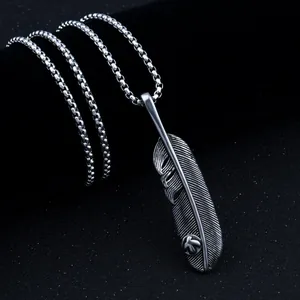 Retro stainless steel feather pendant necklace with detailed textures and bead chain