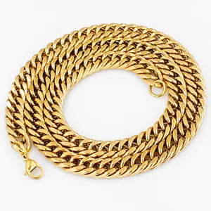 Macro shot of thick gold-plated stainless steel curb chain with lobster clasp detail