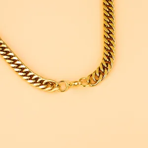 Close-up of golden stainless steel Cuban link necklace showing lobster clasp and polished finish
