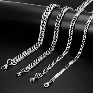Detailed macro view of four different widths of polished silver stainless steel Cuban link chains