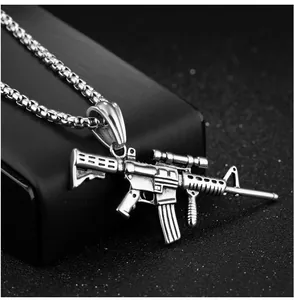 Detailed close-up of retro rifle pendant with gun textures and vintage silver finish