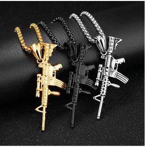 Detail of vintage rifle pendants in gold, black and silver on a dark leather background
