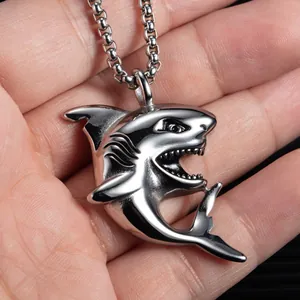 Polished silver shark pendant necklace featuring a detailed jumping pose on a ball chain