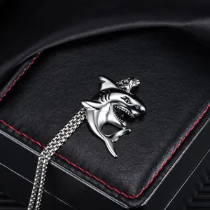 Close-up of hip hop style shark pendant made of polished silver stainless steel