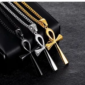 Detailed close-up of Ankh cross necklaces in gold, silver, and black polished finish