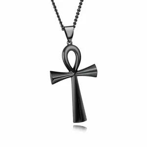 Polished black Ankh cross pendant with matching chain on a clean reflective surface