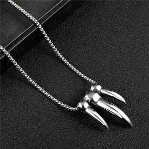 Retro titanium steel necklace featuring realistic skull claw pendants and pearl chain detail