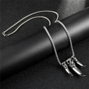 Gothic silver stainless steel necklace with skeleton skull and fang pendants