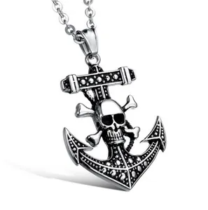 Detail view of punk anchor pendant featuring skull and crossbones with aged metal finish