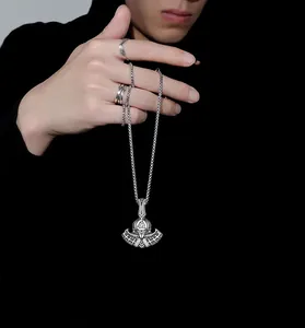 Detail of Viking Thor Hammer pendant and vintage steel rings on a male model