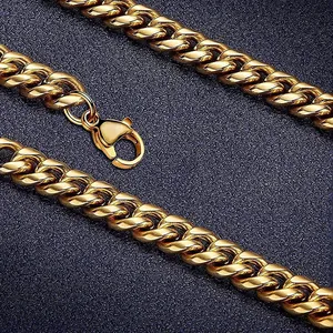 Macro shot of gold-plated Cuban link chain showing the lobster clasp and smooth metallic texture