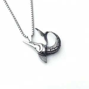 Detailed macro shot of vintage silver marlin pendant with realistic scale textures