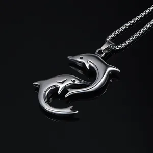 Pendentif dauphin double en acier inoxydable poli avec reflet miroir élégant