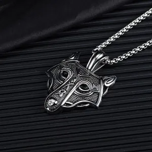 Macro shot of Nordic Celtic wolf head pendant with vintage embossed texture finish