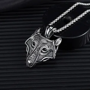 Macro shot of Viking wolf head necklace with detailed Celtic knot engraving and metal chain