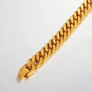 Detailed view of heavy golden Cuban link chain with a square box clasp closure