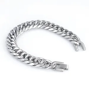 Detail of a bold silver stainless steel Cuban link bracelet with a secure box clasp