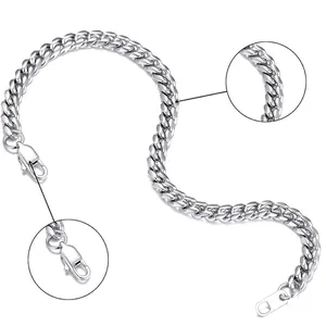 Macro shot of silver Figaro chain link necklace with secure lobster clasp on white surface