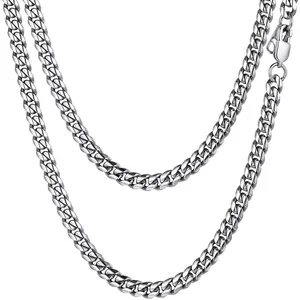 Detailed close-up of a polished silver stainless steel Cuban link chain with lobster clasp