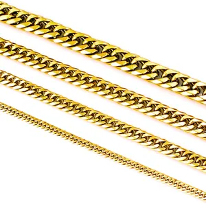 Detail of four different widths of polished golden Cuban link chains for comparison