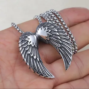 Punk style stainless steel angel wing pendant necklace with vintage feather texture on hand