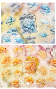 Detail view of cloud stickers for scrapbooking in blue and orange pastel tones