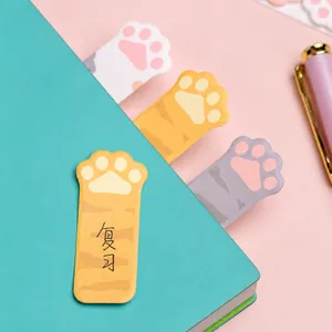 Cute cat paw sticky notes and bookmarks inside a notebook for office and school supplies