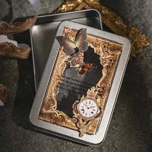 Vintage Baroque decorative storage tin box featuring butterfly and antique clock motifs