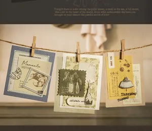 Close-up of vintage scrapbook cards with botanical art and bread illustrations