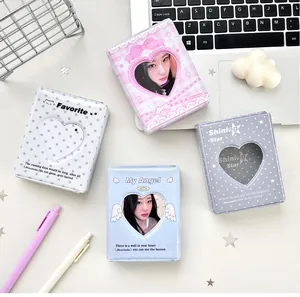 Detailed view of mini photo albums with heart window and diverse pastel patterns