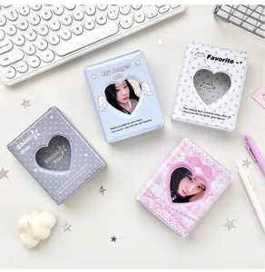 Detailed top view of various mini photocard albums with heart-shaped cutouts and pastel designs