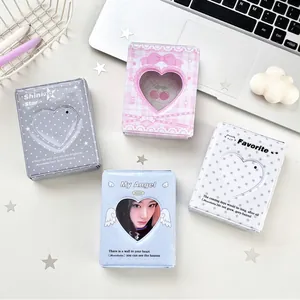 Detailed collection of mini photo albums with heart-shaped cutout for K-pop cards