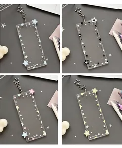 Detail of four colorful acrylic card holders with star patterns and metal keychains