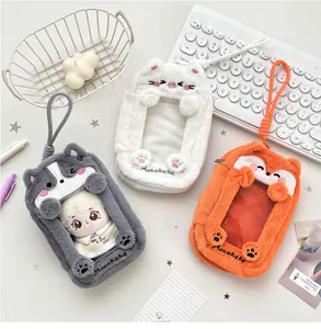 Detail of plush animal card holders with transparent slots and cute paw embroidery