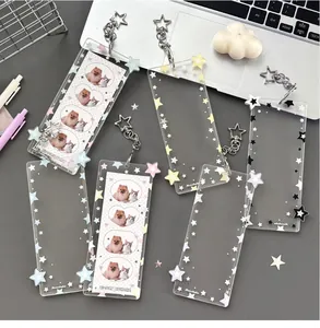 Macro detail of acrylic photocard holders with glitter stars and star-shaped keychains