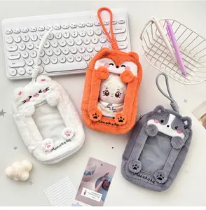 Plush fox and wolf doll carrier bags with transparent window on a clean white desk