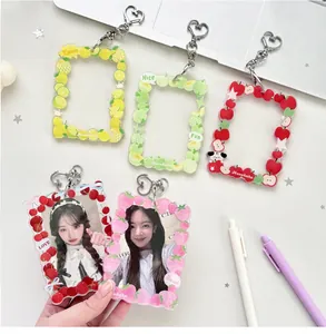 Detailed view of colorful fruit-themed acrylic card holders with silver heart clasps