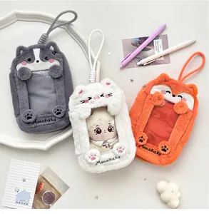 Detailed plush animal card holders in grey, white, and orange with clear windows and straps