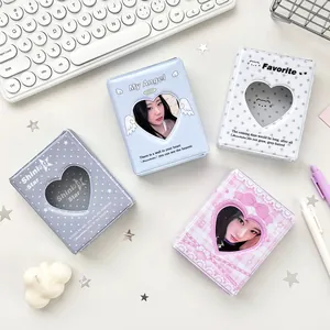 Pastel photocard binders with heart cutout and celestial patterns in four colors