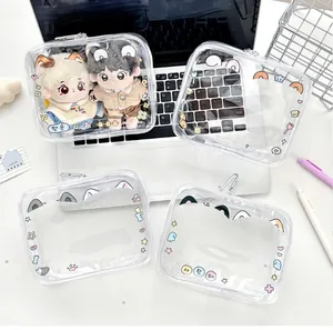 Close-up of cute cartoon printed PVC doll pouches with zipper and metal hooks