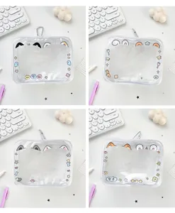 Detail of transparent PVC mini pouch with cute cartoon prints and metal carabiner hook