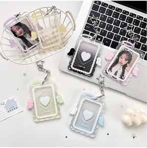 Macro shot of colorful acrylic card holders with angel wings and star keychains