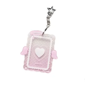 Pink gradient angel wings acrylic photocard holder with star-shaped silver keychain clasp