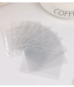 Close-up of high-transparency PVC 3-hole inner sleeves for cartoon mini photo albums