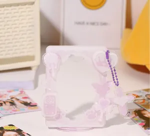 Detail of light purple acrylic photocard holder with cute crown and butterfly patterns
