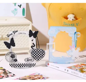 Detail of acrylic photocard holders with checkered patterns and bow decorations