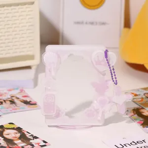 Pink acrylic photo card display stand with cute cartoon motifs and purple beaded chain charm