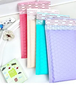 Macro detail of colorful self-adhesive bubble mailers in pink, blue and purple