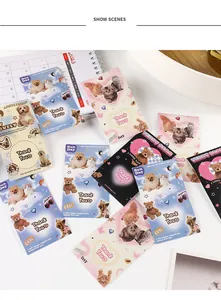 Detail showing Y2K pet stickers with cute dog and cat illustrations on white desk